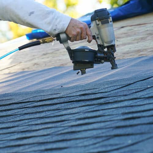 Contractor works on roof leak.