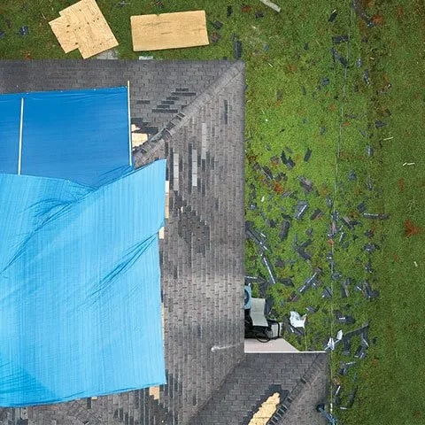 Tarp on roof for emergency roof repair
