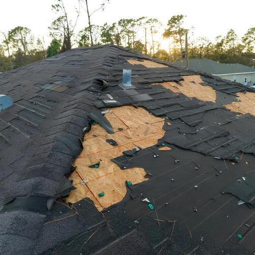 overhead view of a wind damaged roof