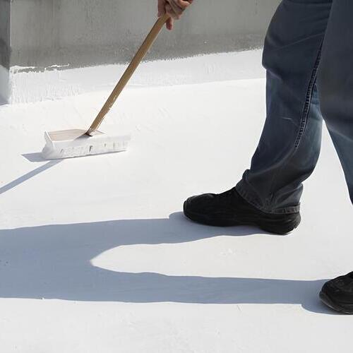 worker providing roof restoration