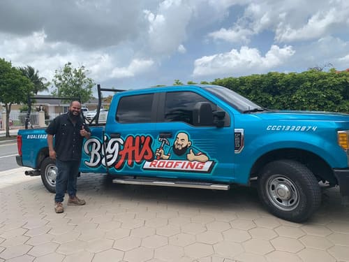 roofer next to his truck