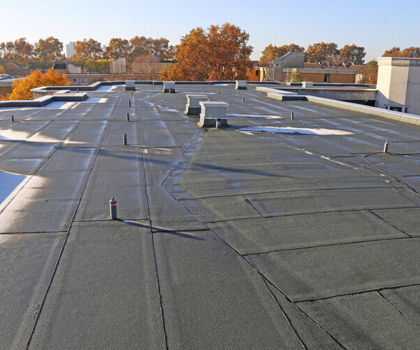 Building with newly renovated built up roof