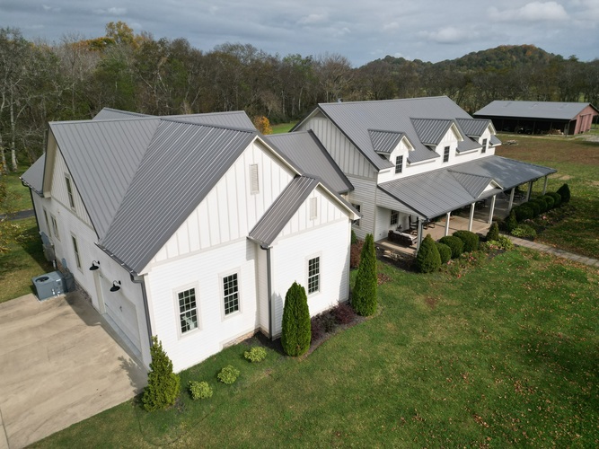 a beautiful home with a metal roof
