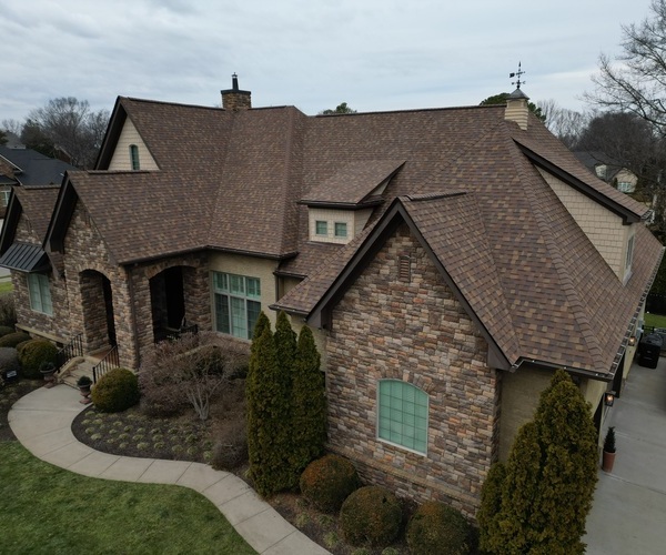 a home with a shingle roof