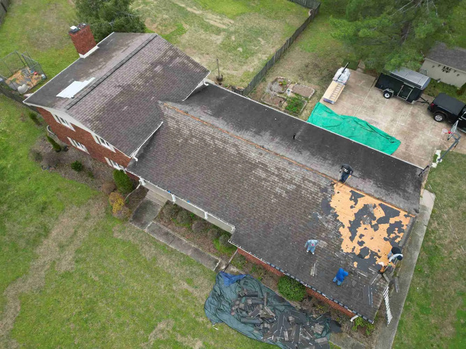 a shingle roof being repaired