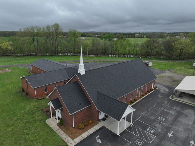 view from above of a church with a shingle roof