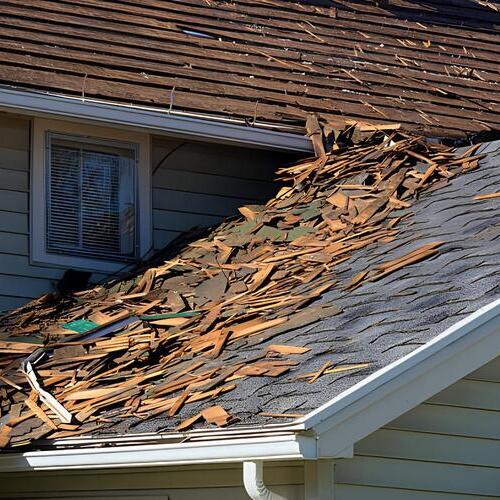 a roof covered in debris from wind