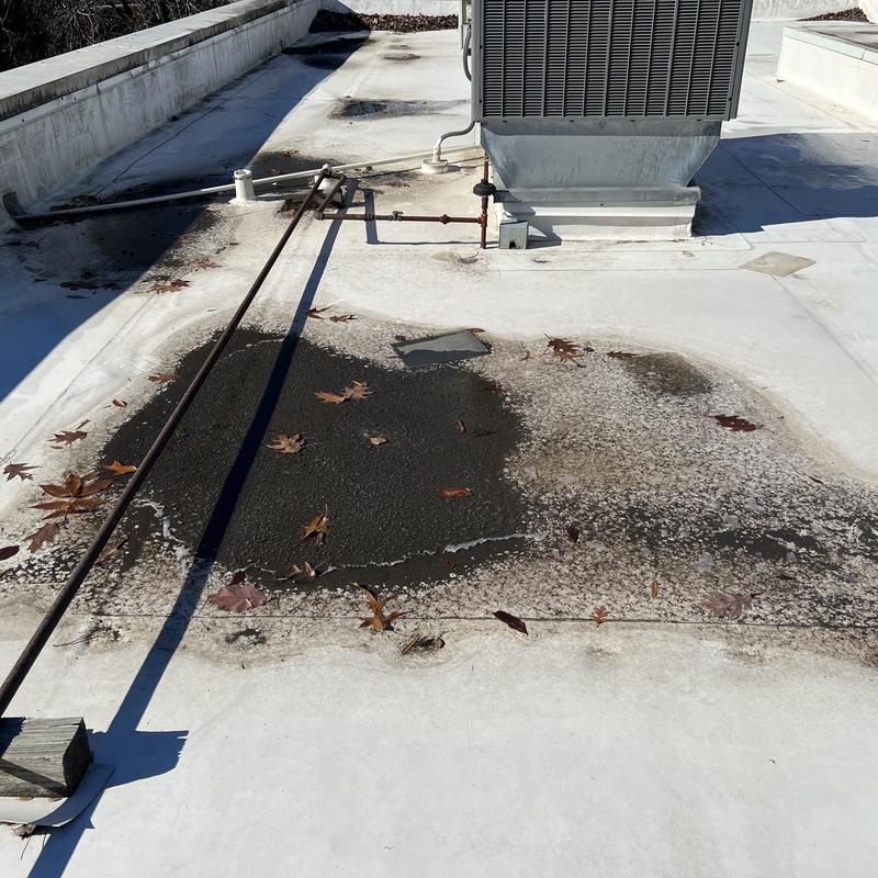dirt and damage on a commercial roof