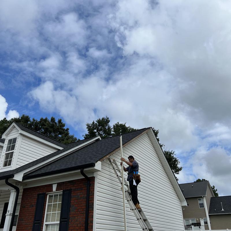 worker providing emergency roof repair to a home