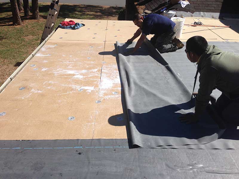 workers on an EPDM roof