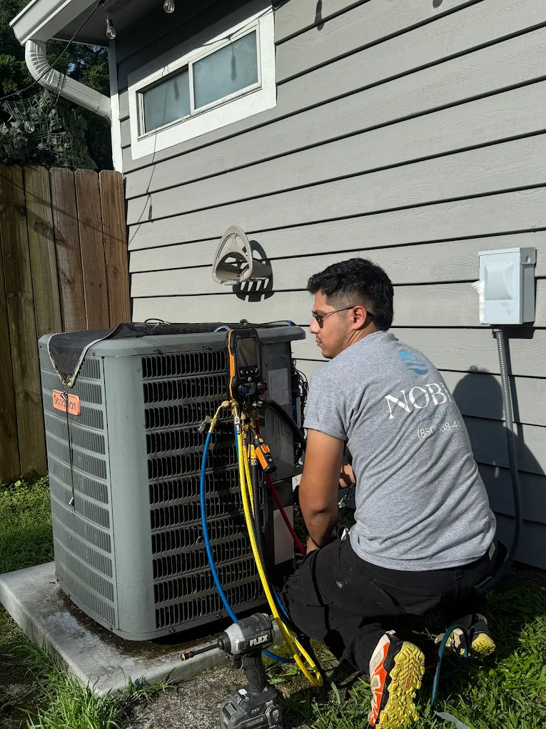 working on an air conditioning unit