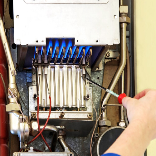 work being done on a gas furnace