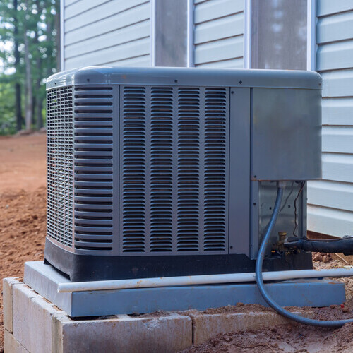 Outside installation of an electric air conditioner on a home's exterior
