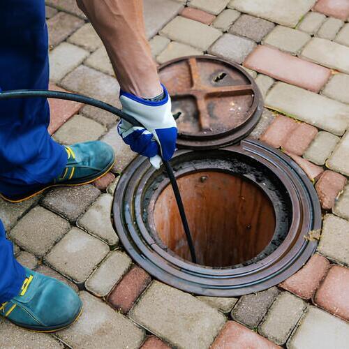 plumber performing hydro jetting services