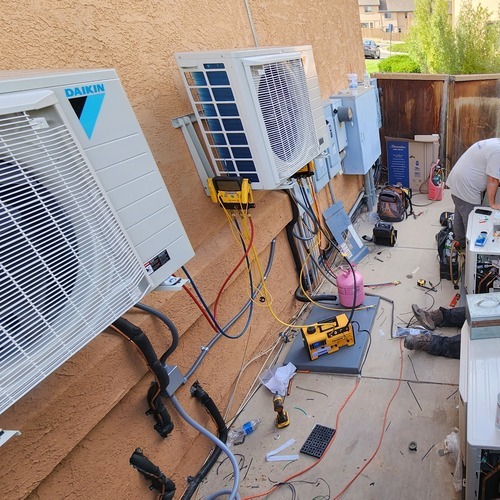 a row of mini-split AC systems