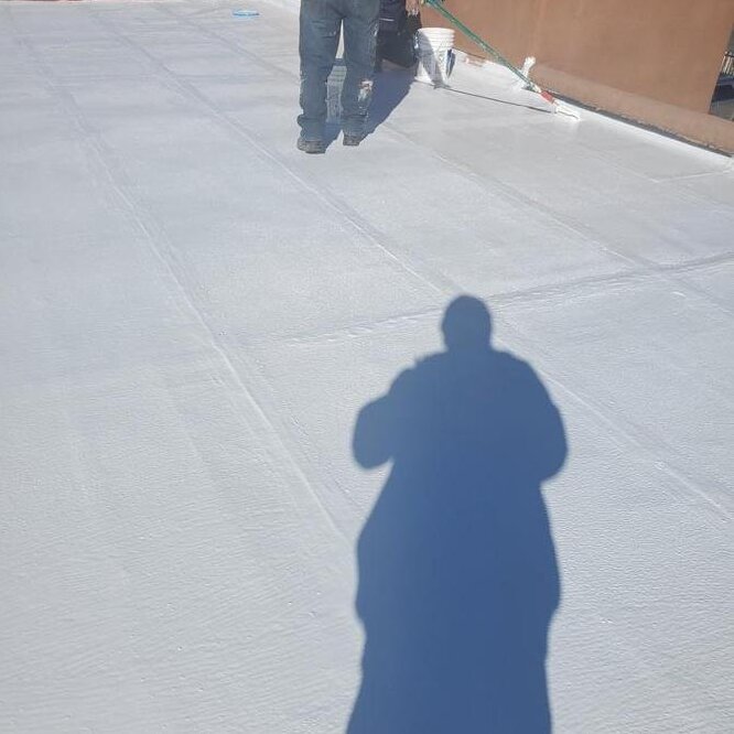 Contractor reviewing roof installation.