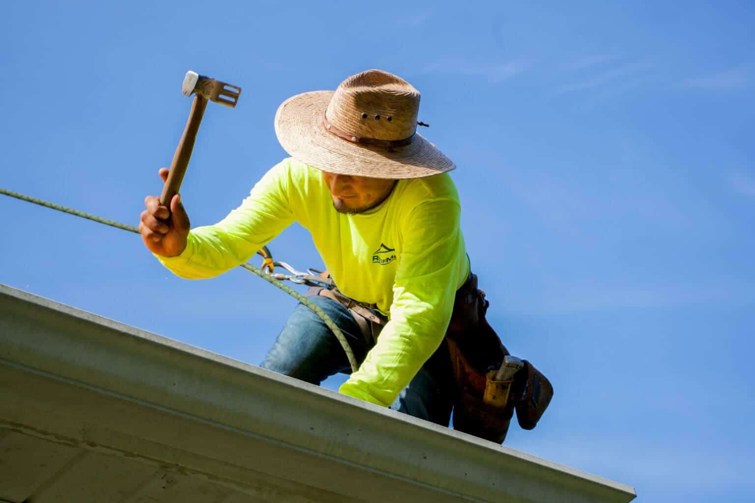A roofer working on a roof.