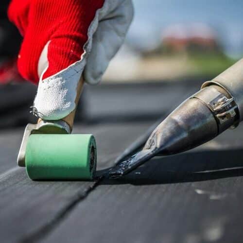 Roofer installs EPDM