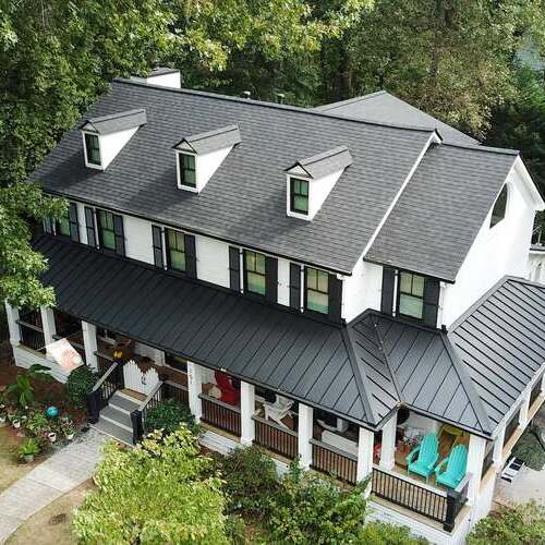 A metal and shingle roof installation