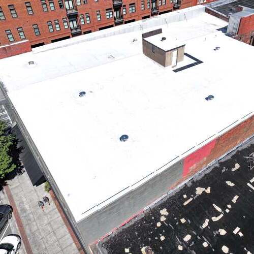 Roof with commercial roof coating