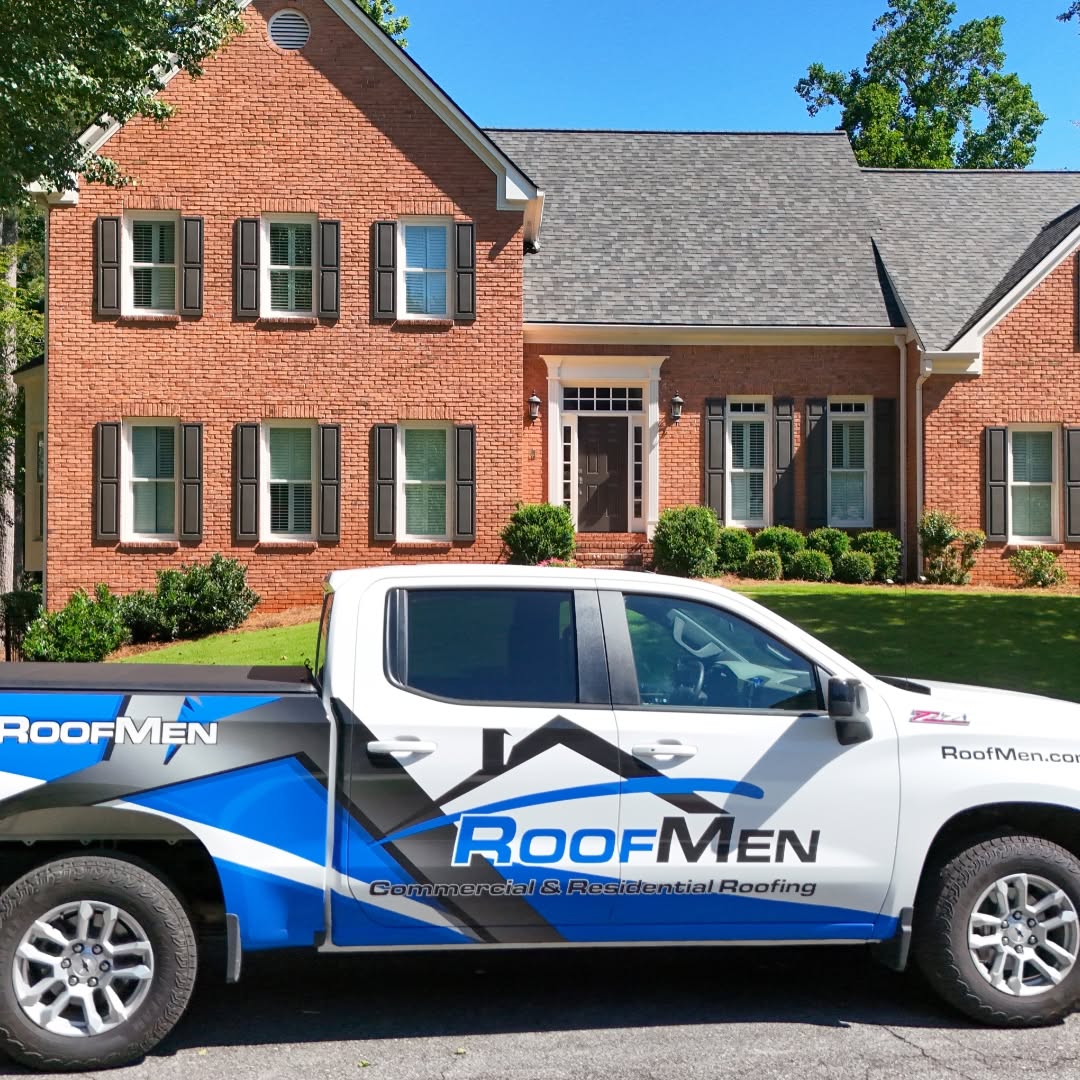 Roofmen truck out side of a home