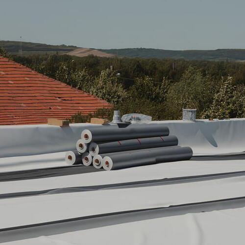rolls of PVC membrane on a flat roof