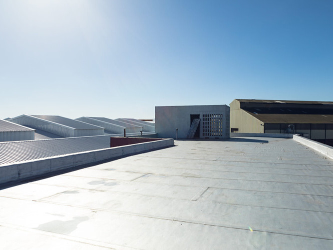 overhead view of a damaged commercial roof