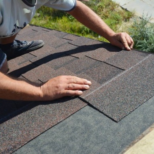 plumber patching a roof