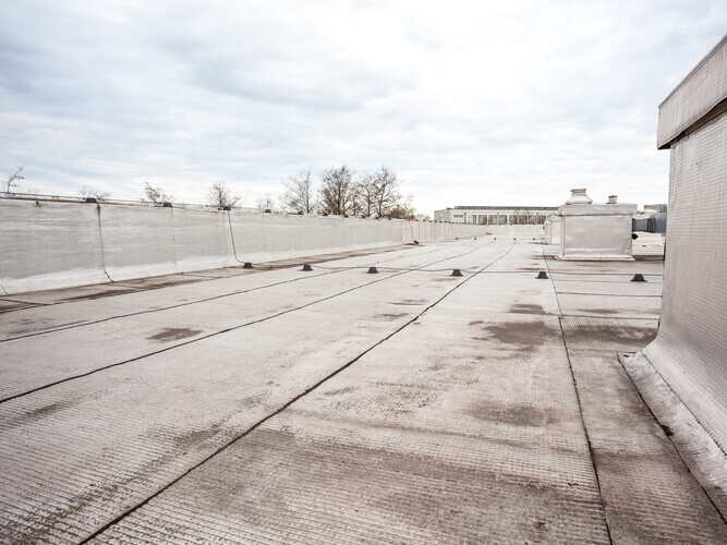 overhead view of a damaged flat roof
