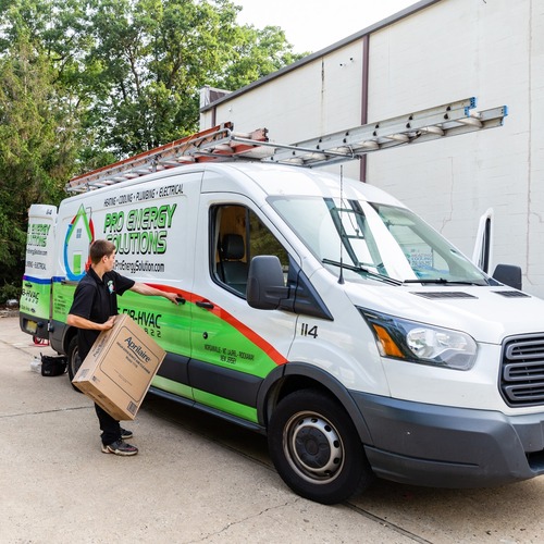 HVAC technician heads for an emergency air conditioner repair.