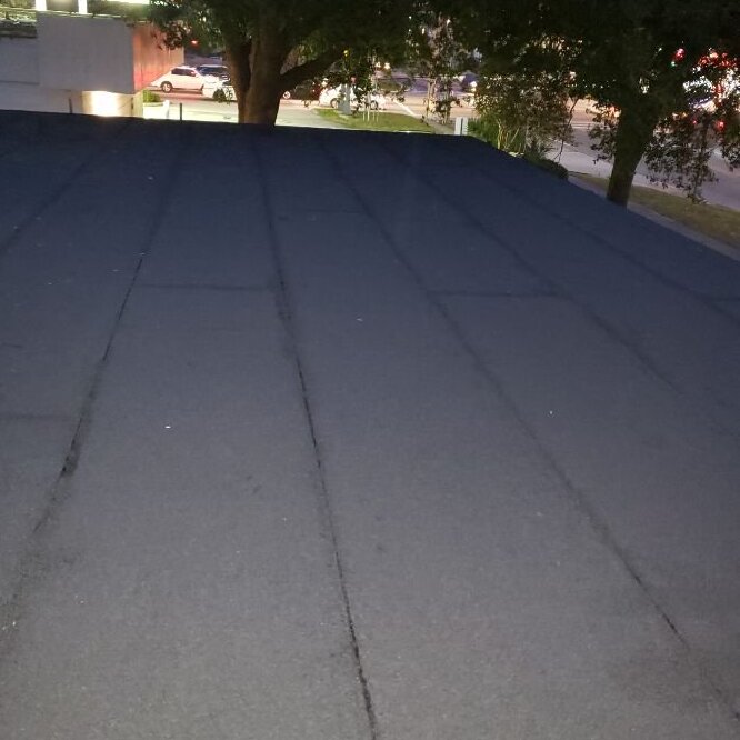 Modified bitumen roof in twilight.