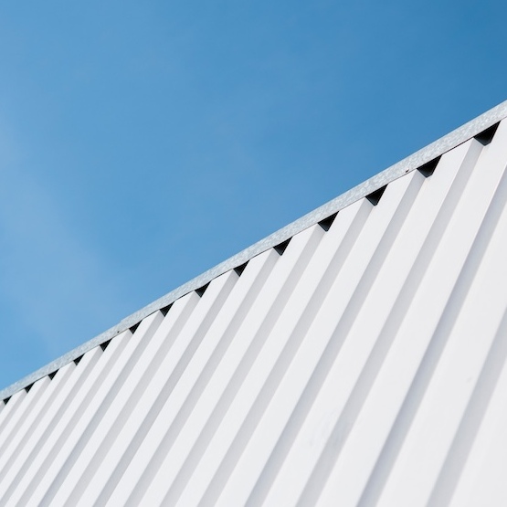 Steel roof with blue sky.