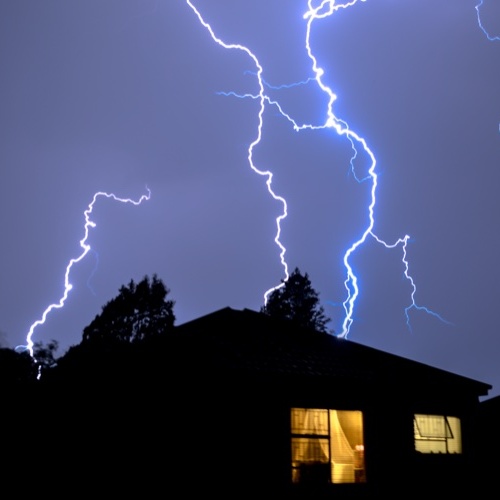 lightning backdrop of house at night