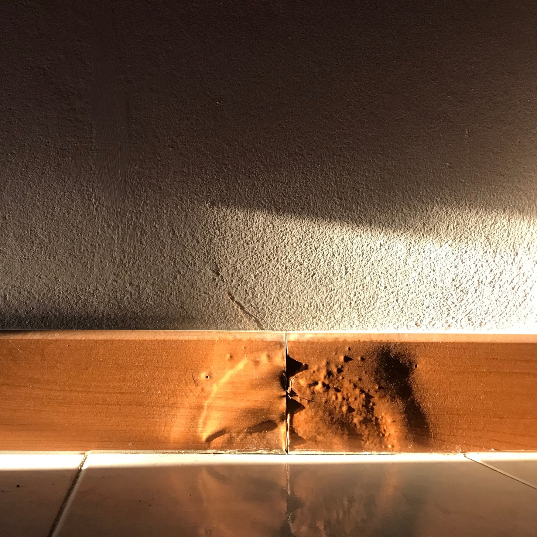 water damage on floor bannister
